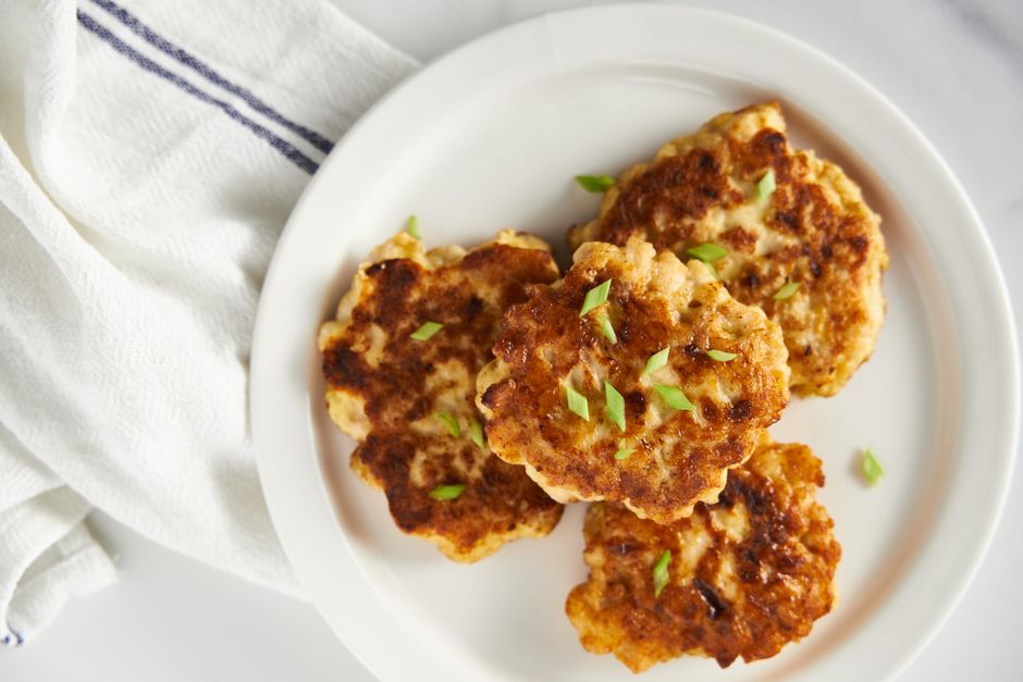 fried pork patties on plate with parsley garnish