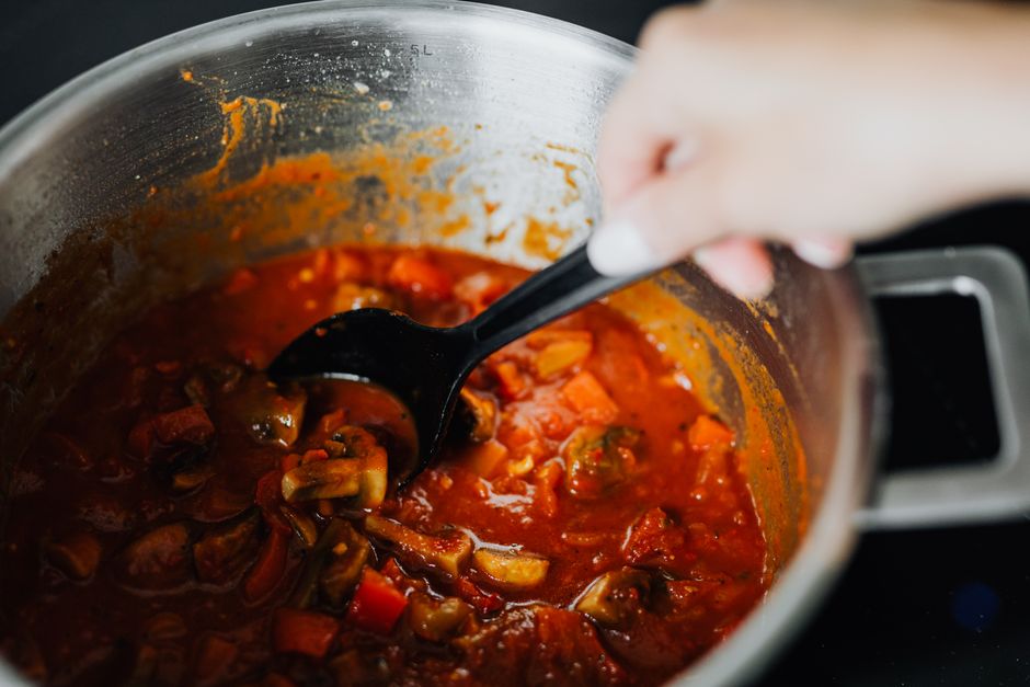 meatballs simmering tomato sauce pot