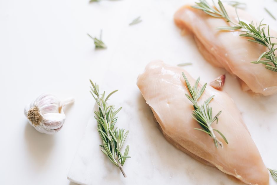 marinated raw chicken thighs with garlic herbs