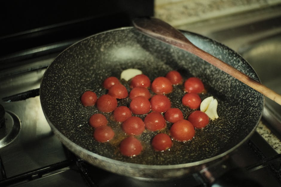 cooking tomatoes garlic pan Italian kitchen