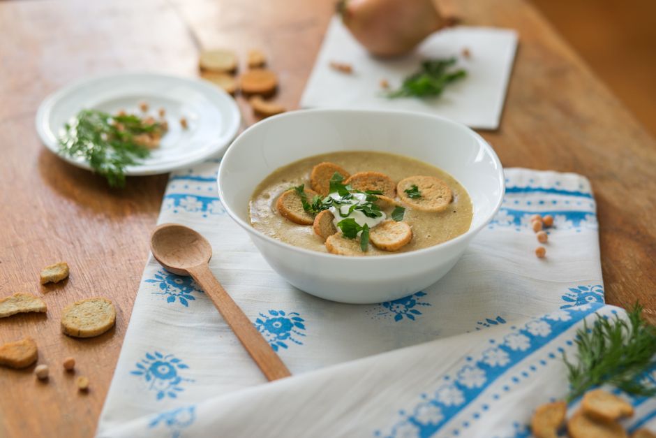 thick goulash soup bowl rustic wooden table