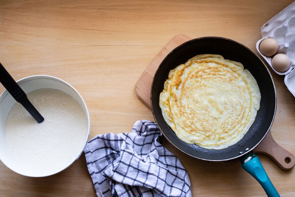 frying thin crepe in pan