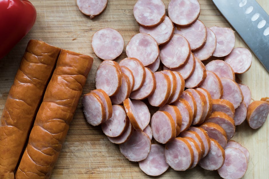 sliced polish sausage kielbasa onions ingredients cooking board