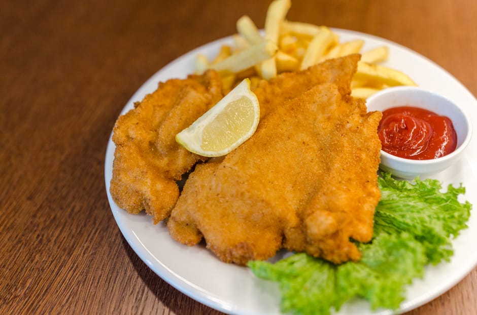 golden crispy pork schnitzel corn flake coating