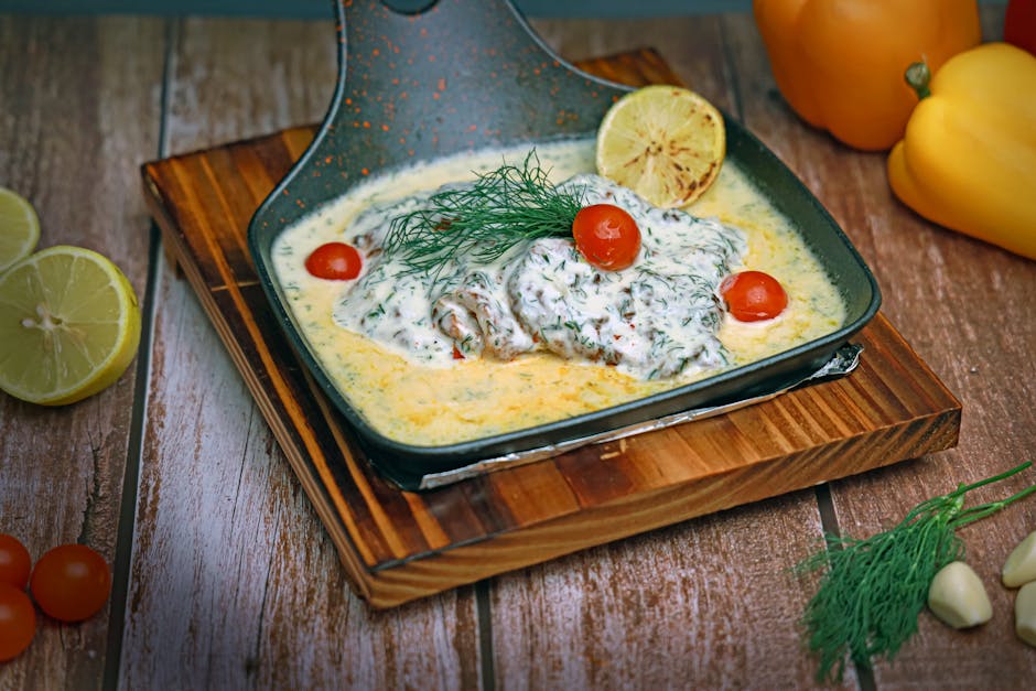 creamy dill sauce in pan with pork meat cooking