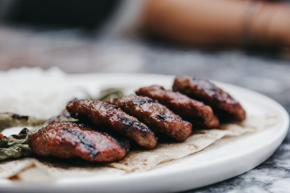 cooked meat patties with vegetables on plate