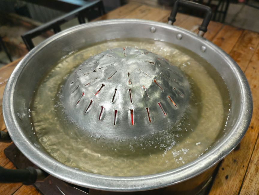 pot simmering gently on stove with lid