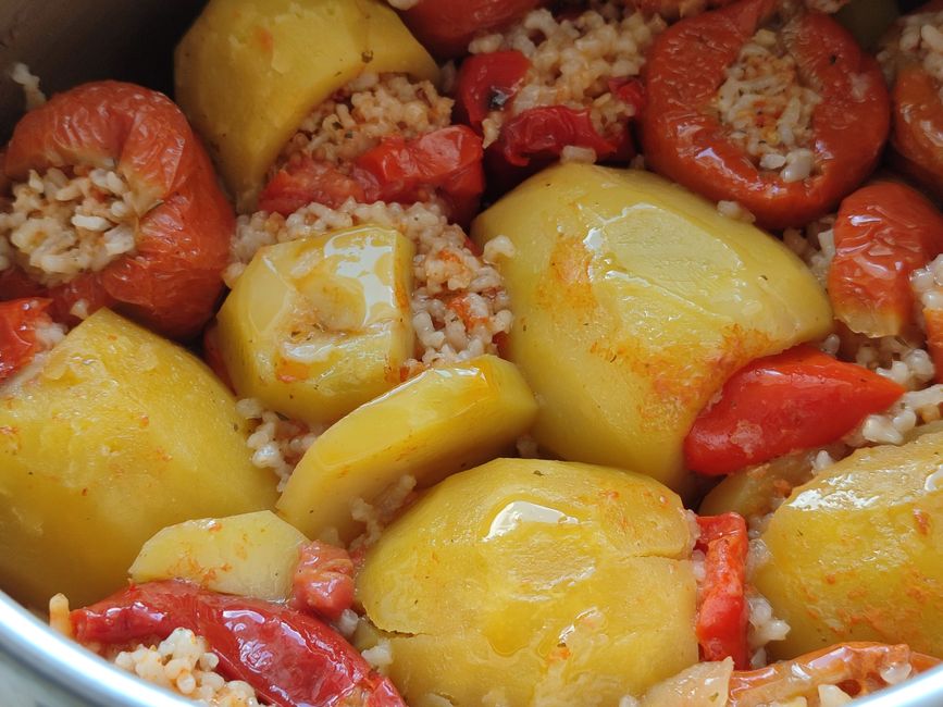 raw red and yellow bell peppers stuffing with minced meat and rice