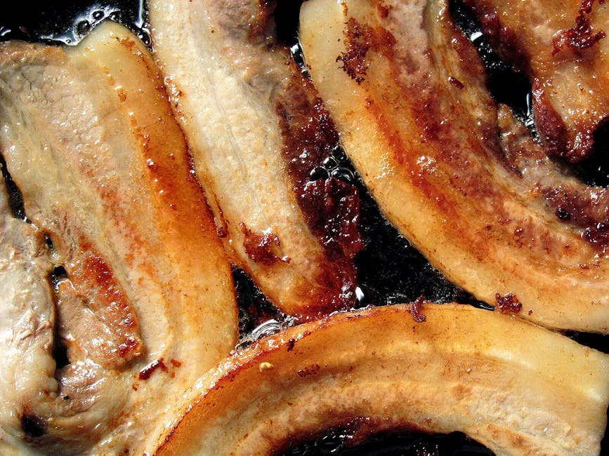 pork meat cooking in frying pan