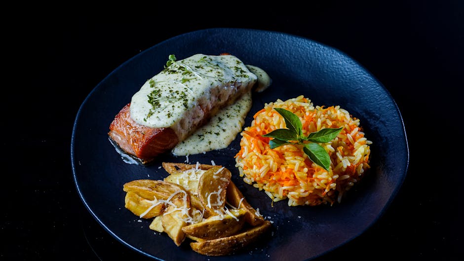 cooked salmon fillet with garlic butter sauce on plate