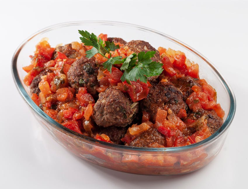 cooked fish meatballs in tomato sauce pan
