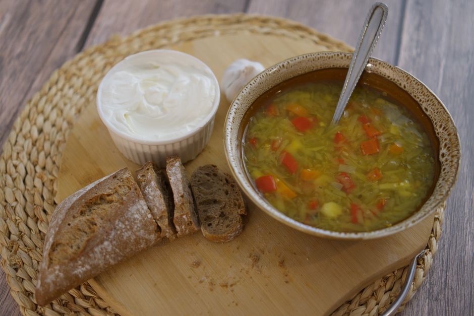 rye flakes in bowl with chicken and zucchini