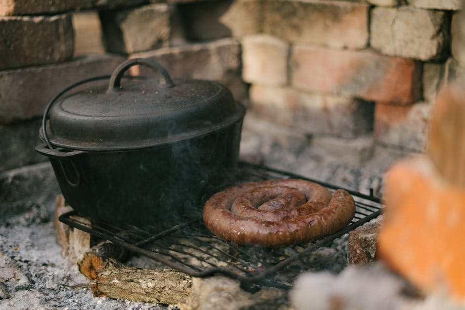 white sausage being cooked in milk in pot