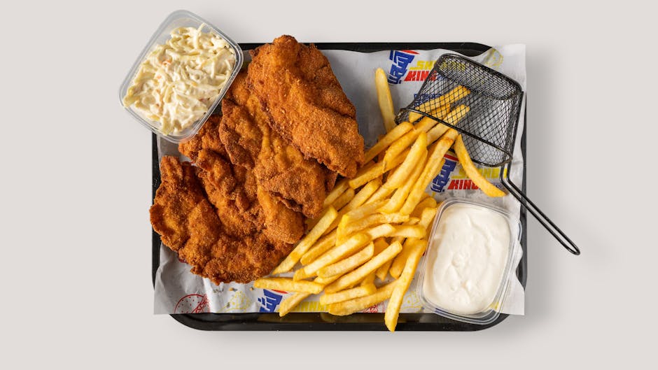 golden fried chicken cutlets on pan with melted cheese