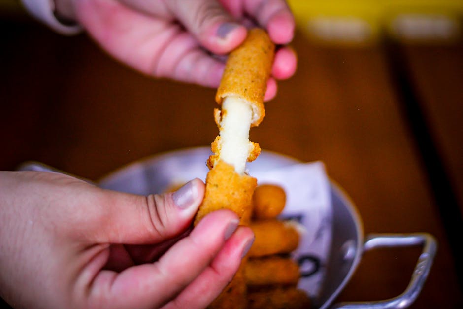 melted mozzarella cheese on fried cutlets