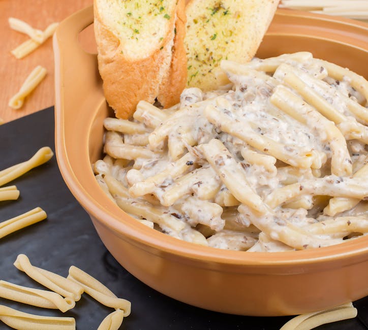 creamy garlic pasta with sausage in pot