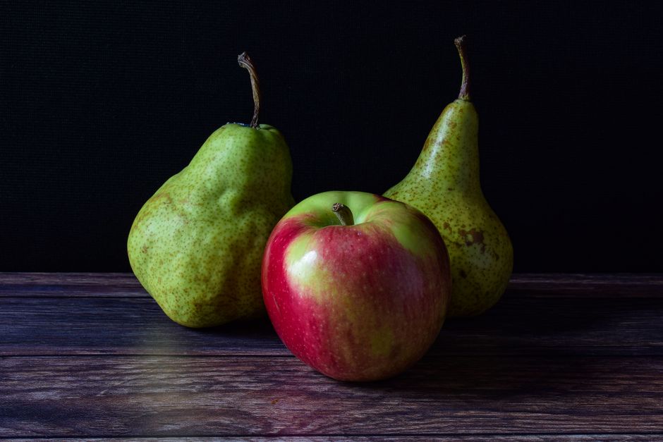 pears and apples on wooden table