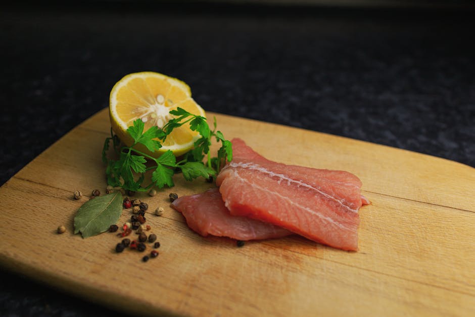 fresh salmon fillets on cutting board with garlic parsley