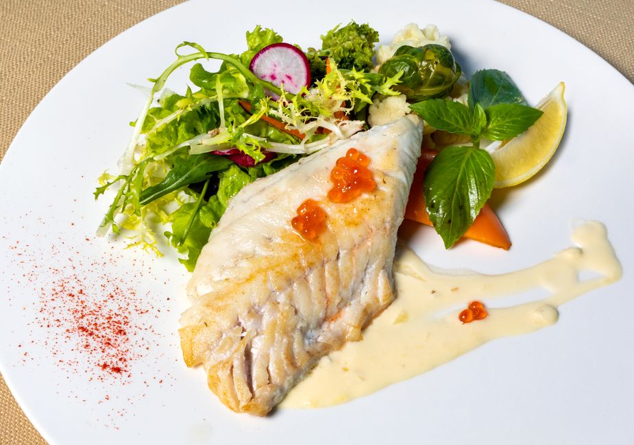 fried fish fillet in vegetable sauce