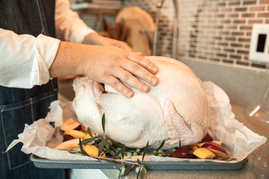 whole duck preparation raw ingredients on kitchen counter