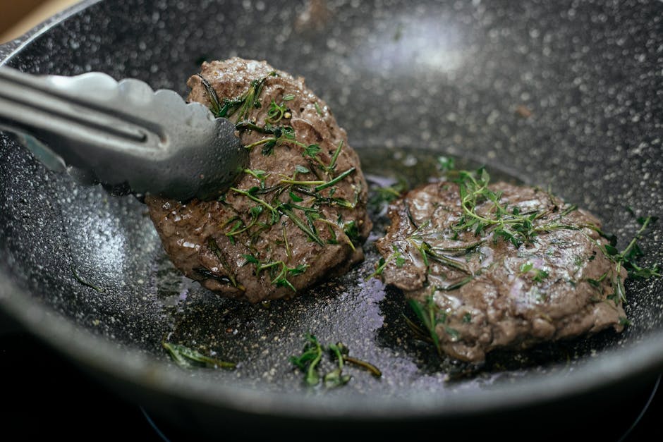 cooked meat patties golden brown pan