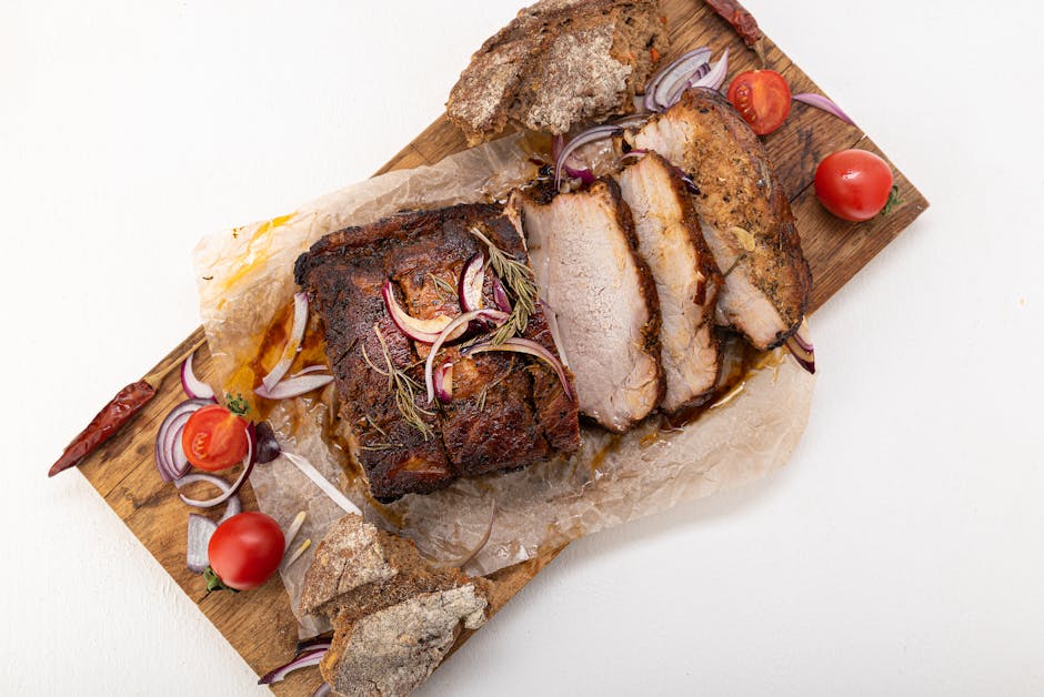 pork roast with onions and herbs in oven