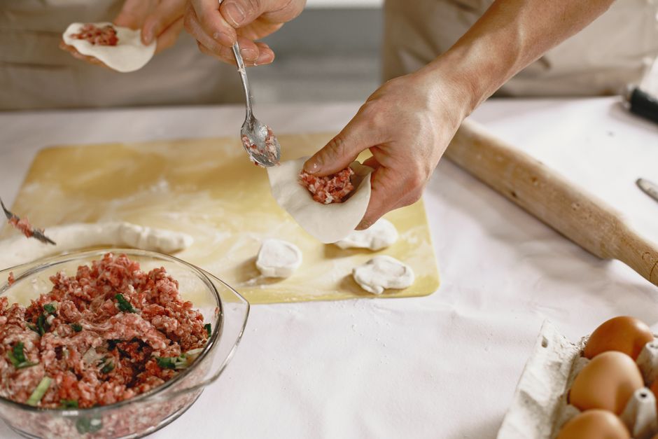 sealing dumplings by hand dough filling