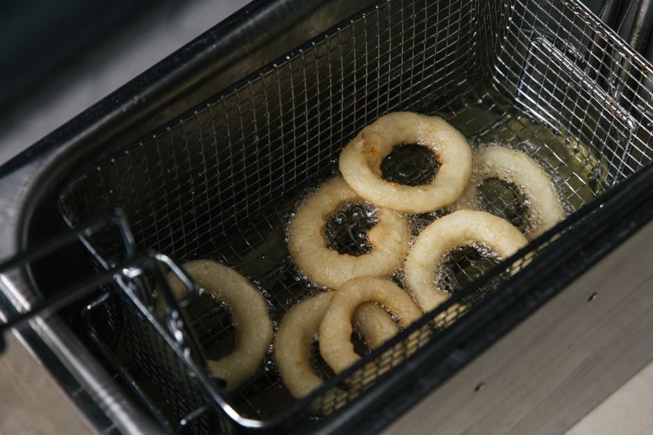 frying apple fritters in pan