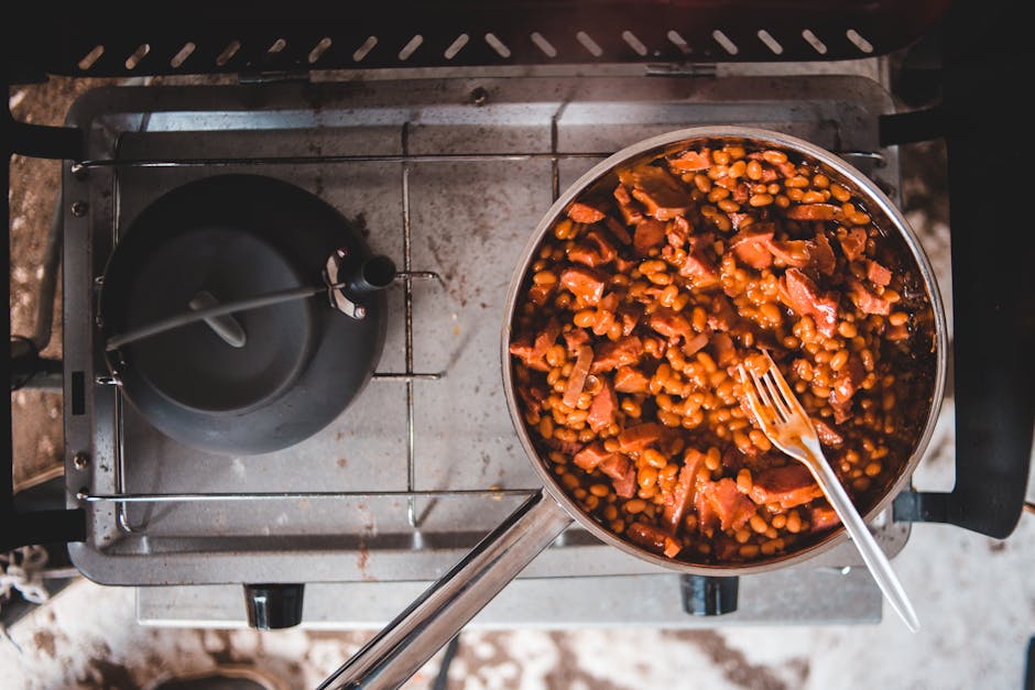 canned beans in tomato sauce cooking pan