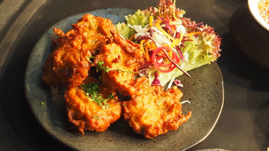 golden fried cheese patties plate herbs
